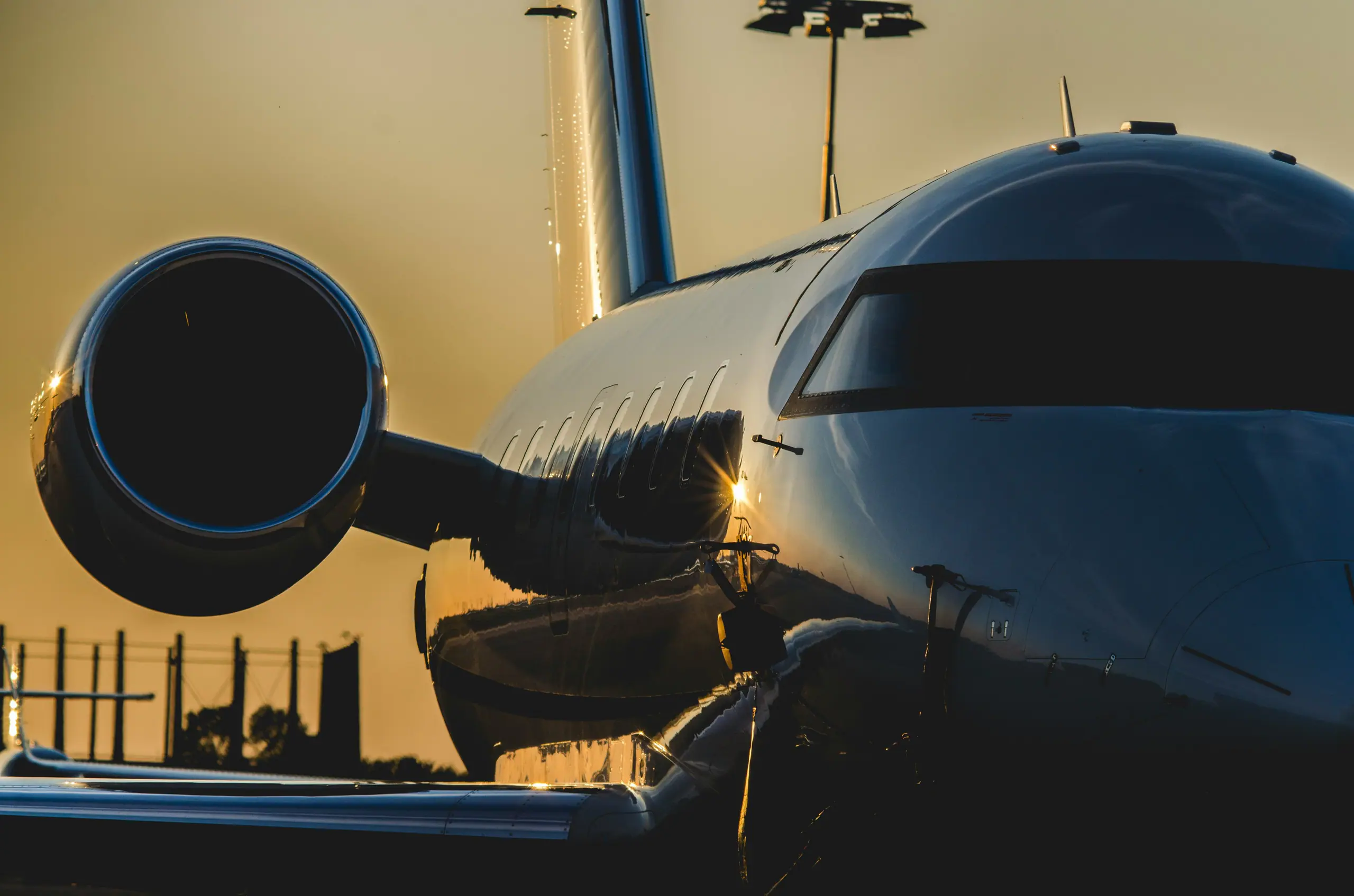 A private jet on the apron at golden hour