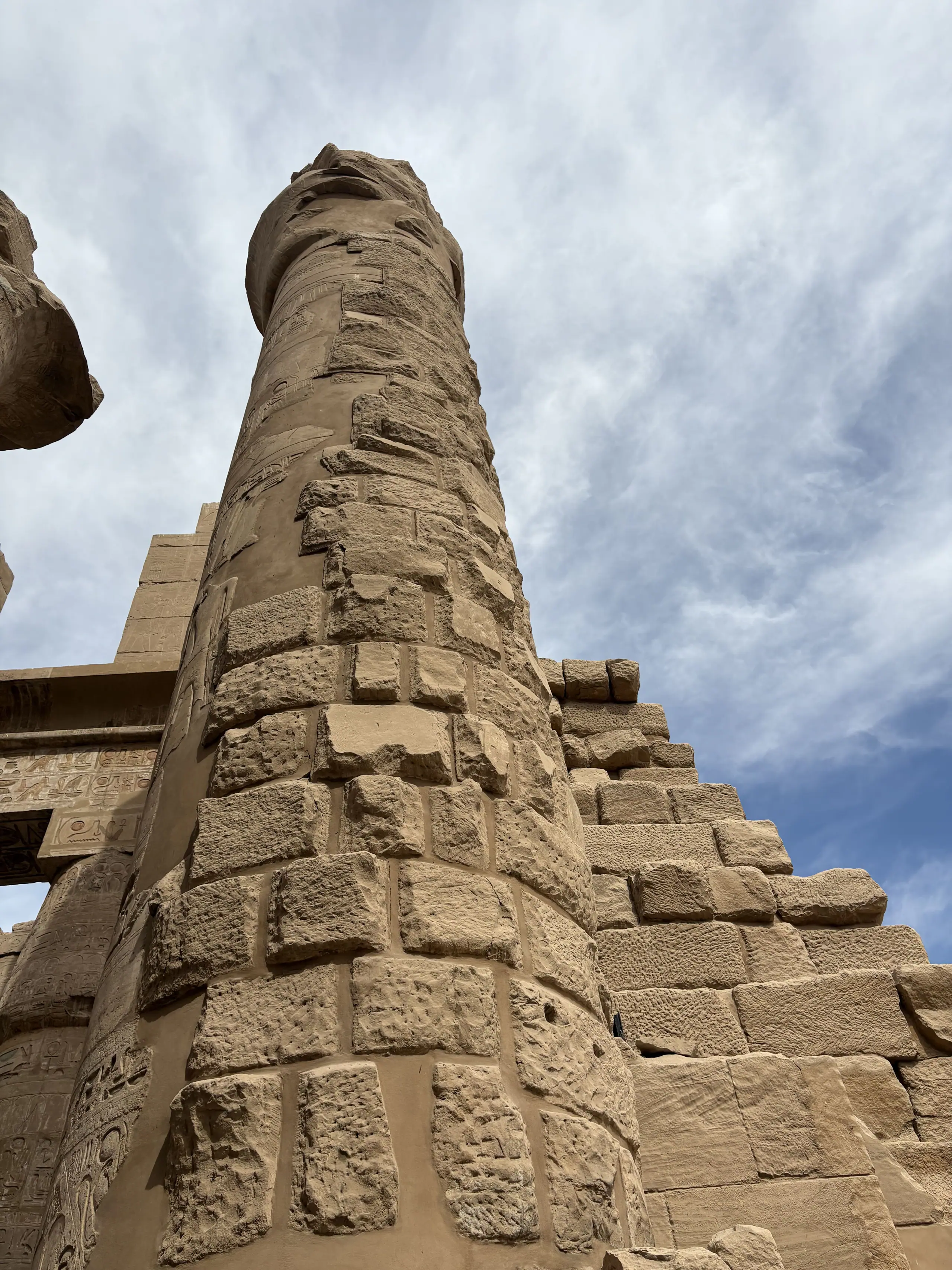 A papyrus column at Karnak, Luxor, seen from below against the sky