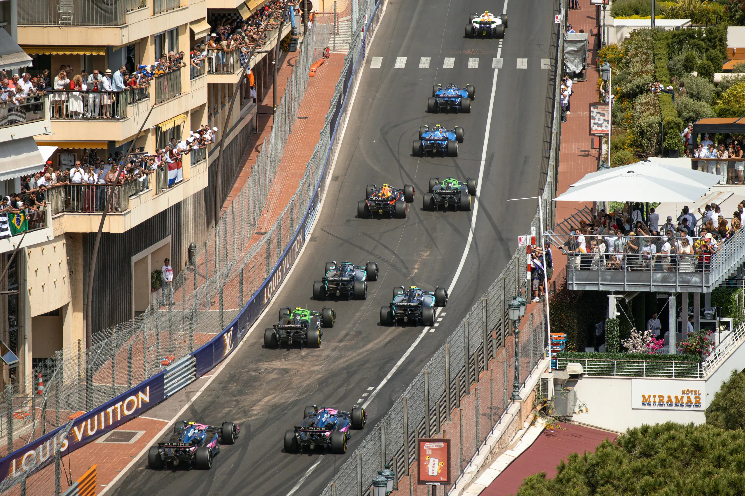 Formula One cars climbing the street circuit at the Monaco Grand Prix