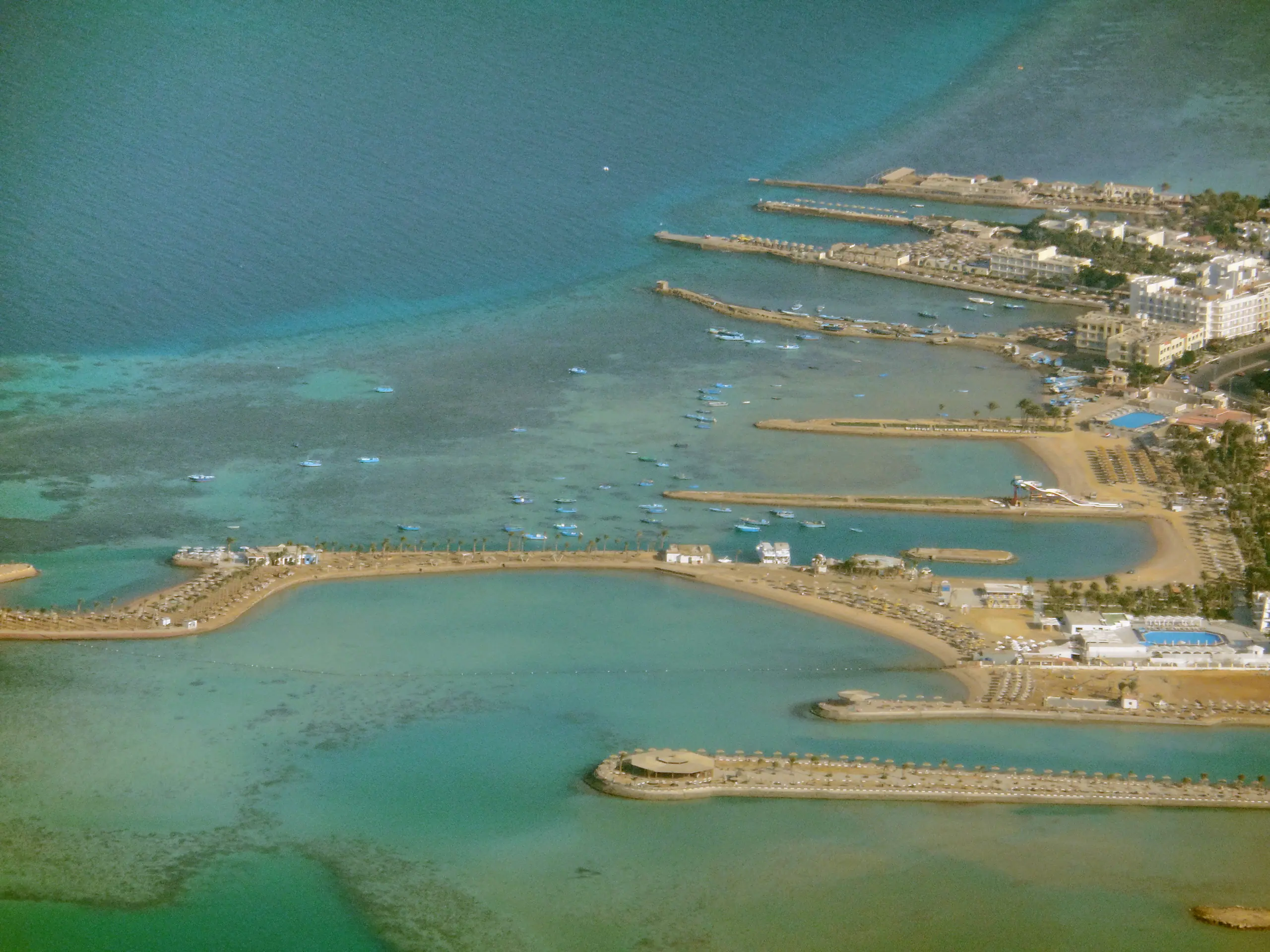 The Red Sea coast near Hurghada from the air: jetties, beaches and reef