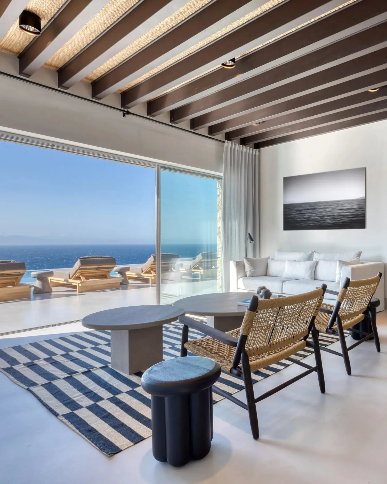 A bright living room opening onto a sea view